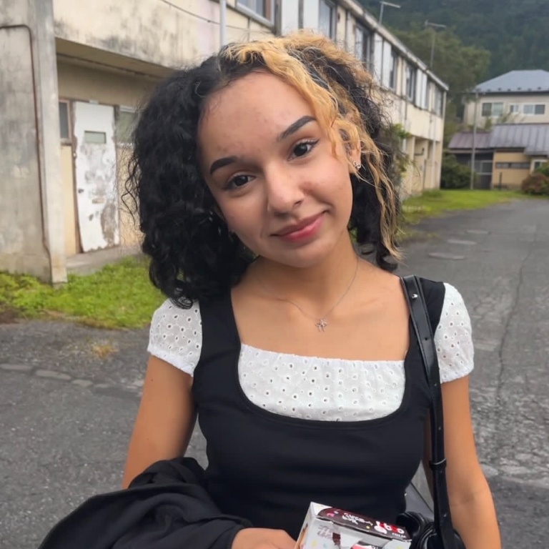 Student smiles at the camera in Japan