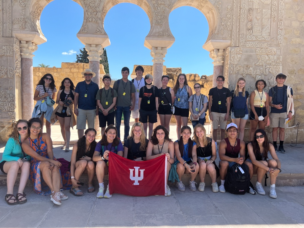Group poses with IU flag in Cordoba