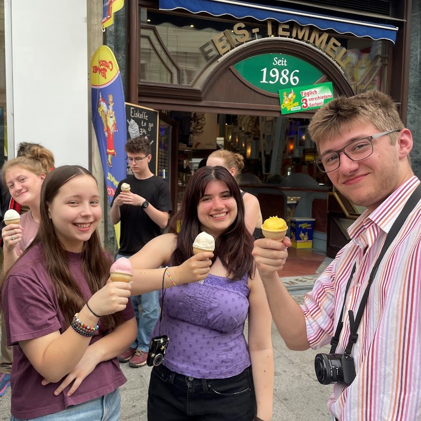 Students stand holding ice cream cones